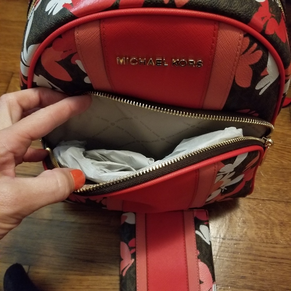 Michael Kors backpack and wallet.